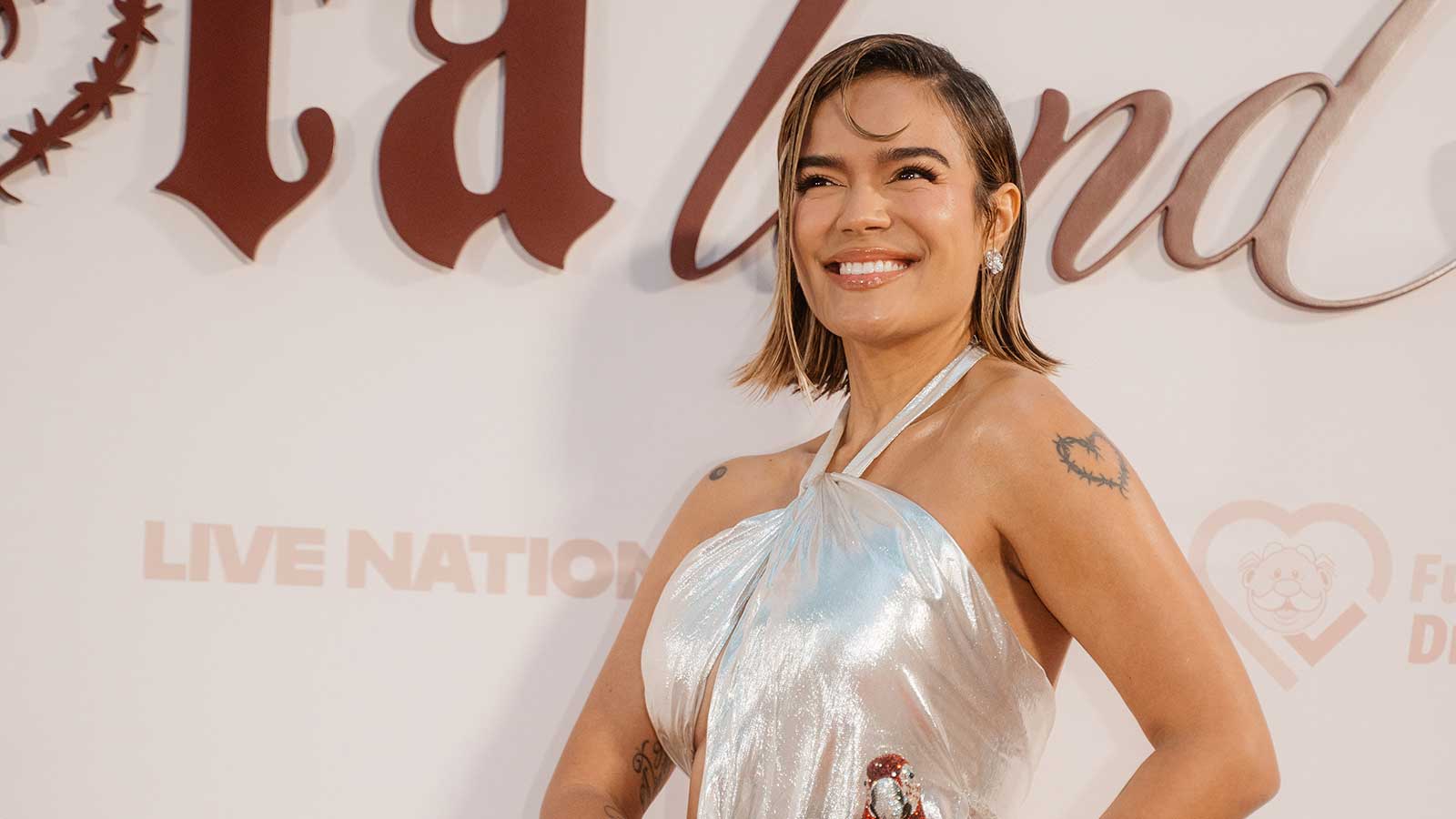 Karol G wearing Celia Kritharioti liquid silver couture gown at Con Cora Land Gala 2026 in Miami